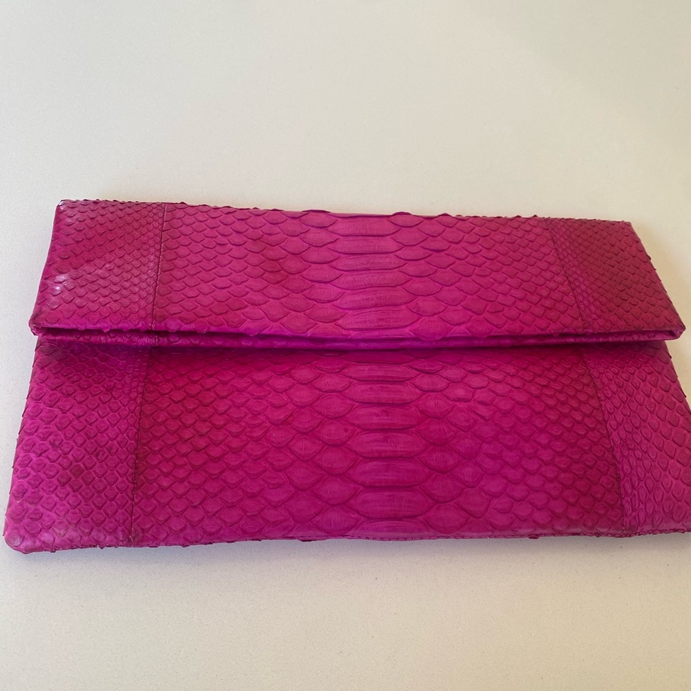 Snakeskin Fuchsia clutch bag.
